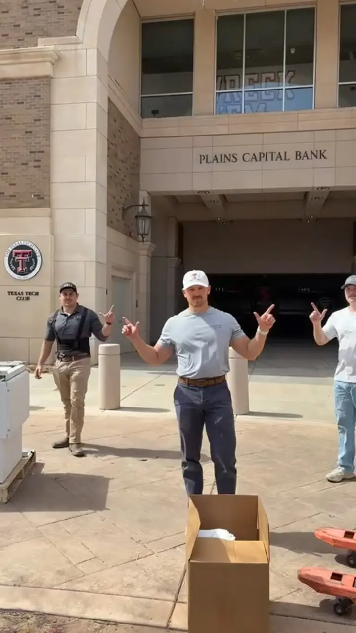 GRIT crew outside a downtown Lubbock bank during an office move