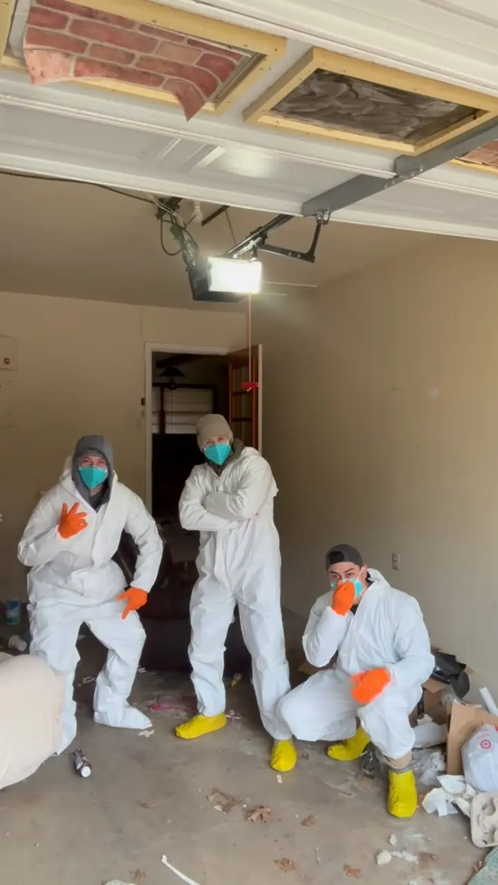 GRIT cleanup crew in protective suits before a heavy-duty property cleaning job
