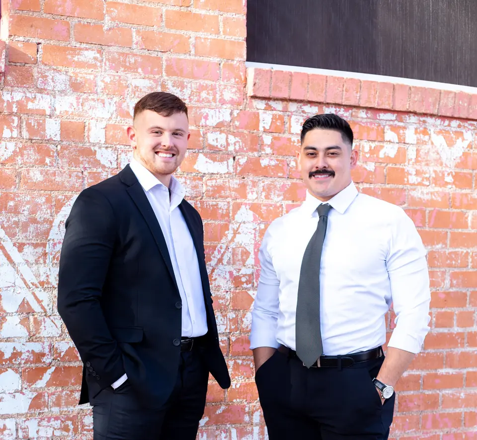 GRIT co-founders Paul Rosas and Michael Guadagnoli in front of a brick wall in Lubbock