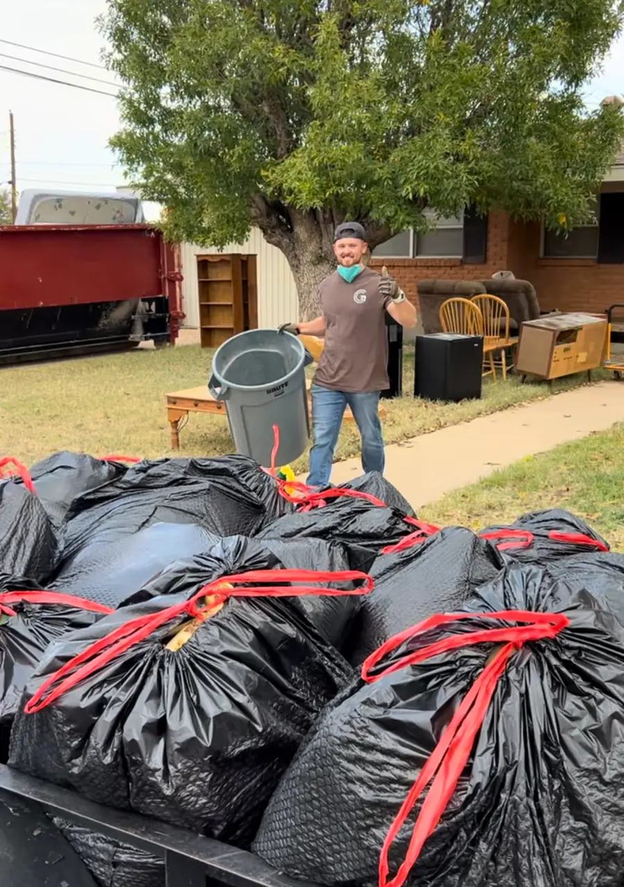 Bagged junk and debris piled for removal during a GRIT property cleanout in Lubbock