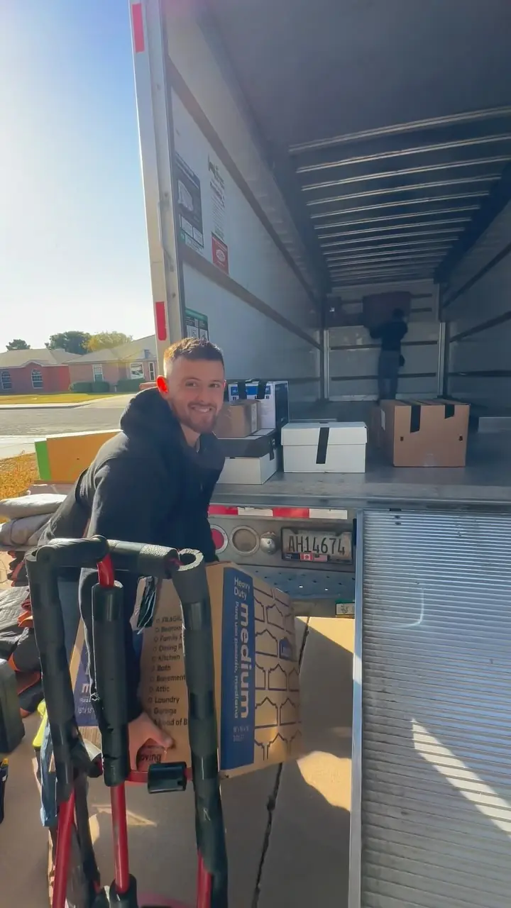 GRIT mover loading a box truck during a labor-only moving job