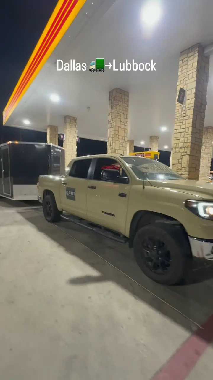 GRIT truck and trailer stopped at night during a Dallas to Lubbock long-distance move
