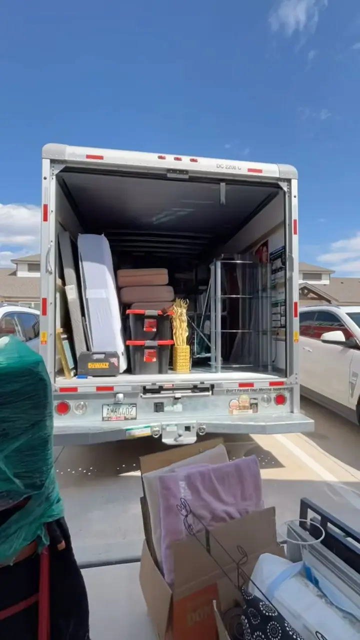 Moving truck neatly loaded with boxes and furniture by the GRIT crew