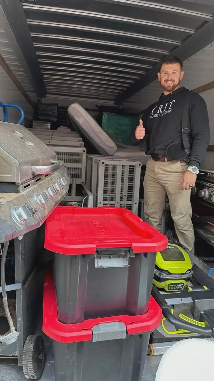 GRIT mover unloading totes and storage bins from the back of a truck